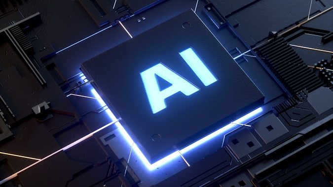 Mikrochip mit der Aufschrift "AI" in leuchtendem Blau auf dunklem Hintergrund.